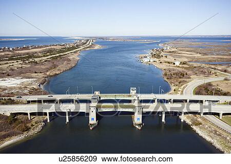Stock Photo - Aerial view of aerial view of waterway with two bridges on Robert Moses Causeway, New York. . Fotosearch