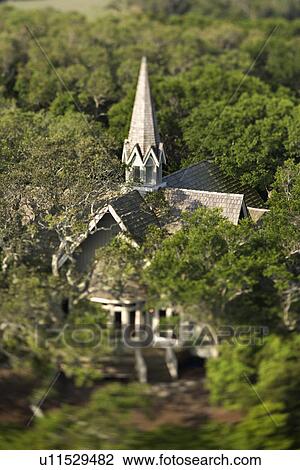 Aerial view of church surrounded by trees on Bald Head Island, North Carolina. View Large Photo Image Stock Image - Aerial view of church surrounded by trees on Bald Head Island, North Carolina. . Fotosearch