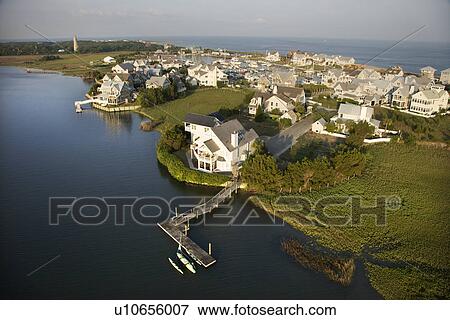 Stock Photo - Aerial view of coastal residential community on Bald Head Island, North Carolina. Fotosearch