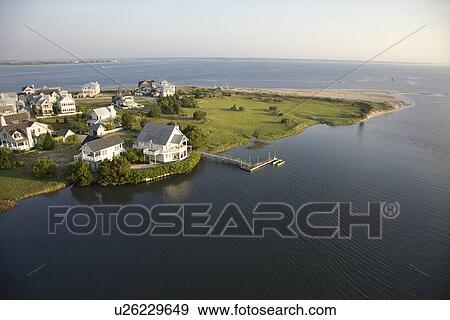 Aerial view of houses and ocean at Bald Head Island, North Carolina. View Large Photo Image Stock Photo - Aerial view of houses and ocean at Bald Head Island, North Carolina.. Fotosearch