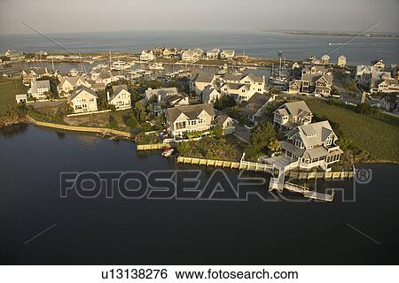 Stock Photograph - Aerial view of houses and ocean at Bald Head Island, North Carolina.. Fotosearch