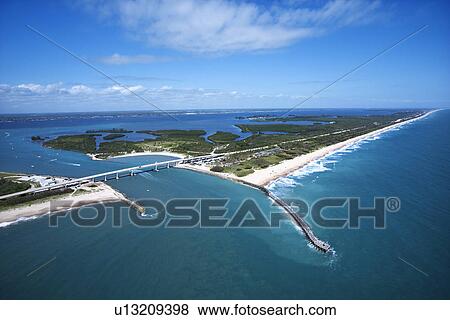 Stock Photo - Aerial view of Indian River Lagoon Scenic Highway on Melbourne Beach, Florida with inlet and pier.. Fotosearch