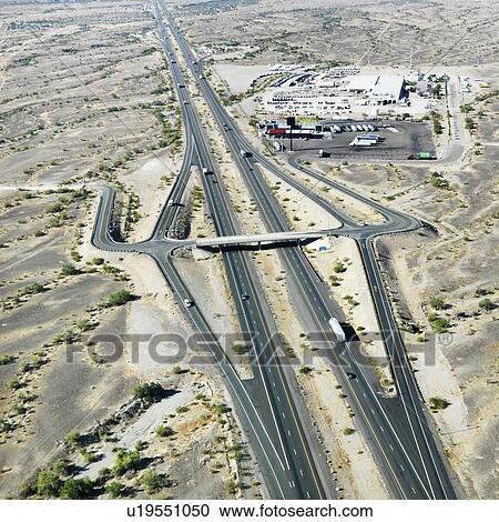 Stock Image - Aerial view of interstate 10 in southwest desert landscape of Arizona.. Fotosearch