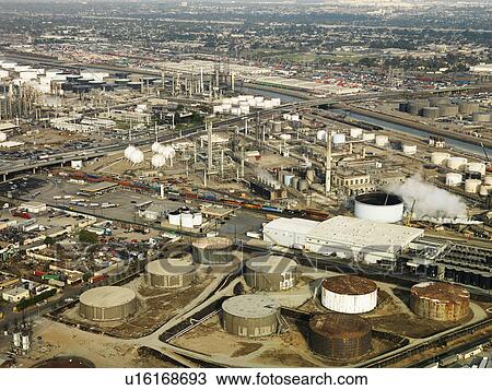 Stock Image - Aerial view of liquid storage tanks in Los Angeles California oil refinery. Fotosearch