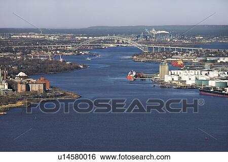 Stock Photograph - Aerial view of New York City's Bayonne Bridge and harbor.. Fotosearch