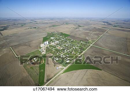 Aerial view of rural town surrounded by cropland and agriculture. View Large Photo Image Picture - Aerial view of rural town surrounded by cropland and agriculture.. Fotosearch