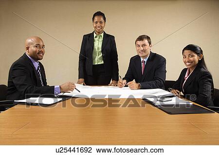 Businesspeople having meeting at conference table. View Large Photo Image Stock Image - Businesspeople having meeting at conference table.. Fotosearch