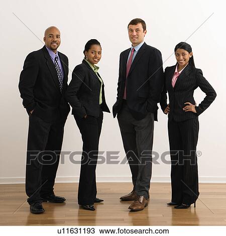 Portrait of businessmen and businesswomen standing smiling. View Large Photo Image Stock Image - Portrait of businessmen and businesswomen standing smiling.. Fotosearch