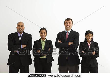 Portrait of businessmen and businesswomen standing smiling with arms crossed View Large Photo Image Stock Photo - Portrait of businessmen and businesswomen standing smiling with arms crossed. Fotosearch