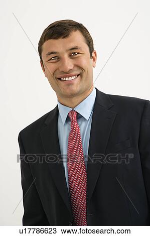 Portrait of smiling businessman against white background. View Large Photo Image Stock Image - Portrait of smiling businessman against white background.. Fotosearch