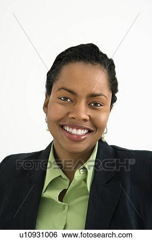 Stock Photograph - Portrait of smiling businesswoman against white background.. Fotosearch