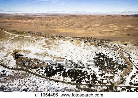 Aerial landscape of snowy plains and dunes in Great Sand Dunes National Park, Colorado View Large Photo Image Stock Photograph - Aerial landscape of snowy plains and dunes in Great Sand Dunes National Park, Colorado. Fotosearch