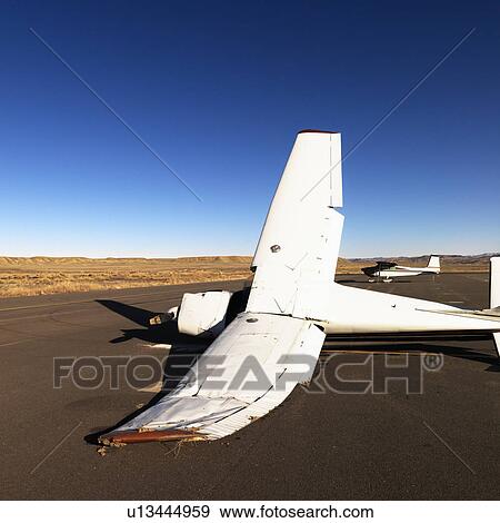 Crashed plane on tarmac at Canyonlands Field Airport, Utah, United States. View Large Photo Image Stock Photo - Crashed plane on tarmac at Canyonlands Field Airport, Utah, United States.. Fotosearch