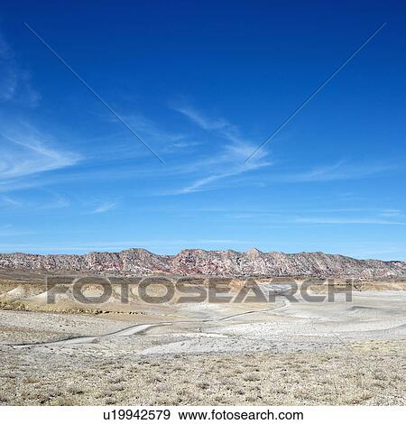 Desert landscape with rocky cliffs in background in Cottonwood Canyon, Utah. View Large Photo Image Stock Photo - Desert landscape with rocky cliffs in background in Cottonwood Canyon, Utah. . Fotosearch