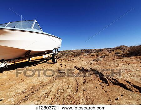 Landscape of motorboat sitting in the middle of the desert in rural Arizona, United States. View Large Photo Image Stock Image - Landscape of motorboat sitting in the middle of the desert in rural Arizona, United States.. Fotosearch