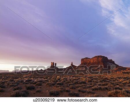 Scenic landscape at dusk of mesas in Monument Valley near the border of Arizona and Utah View Large Photo Image Stock Photo - Scenic landscape at dusk of mesas in Monument Valley near the border of Arizona and Utah. Fotosearch