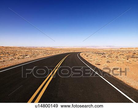 Scenic landscape of desert highway in rural Arizona, United States. View Large Photo Image Stock Photo - Scenic landscape of desert highway in rural Arizona, United States.. Fotosearch
