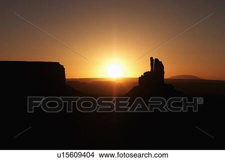 Scenic sunset landscape of mesas in Monument Valley near the border of Arizona and Utah, United States. View Large Photo Image Picture - Scenic sunset landscape of mesas in Monument Valley near the border of Arizona and Utah, United States.. Fotosearch
