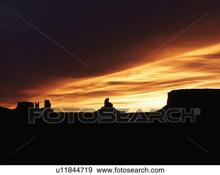 Scenic sunset landscape of mesas in Monument Valley near the border of Arizona and Utah, United States. View Large Photo Image Stock Photo - Scenic sunset landscape of mesas in Monument Valley near the border of Arizona and Utah, United States.. Fotosearch