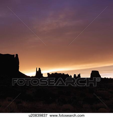 Scenic sunset landscape of mesas in Monument Valley View Large Photo Image Stock Photo - Scenic sunset landscape of mesas in Monument Valley . Fotosearch