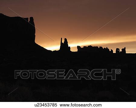 Scenic sunset landscape of mesas in Monument Valley near the border of Arizona and Utah, United States. View Large Photo Image Stock Photography - Scenic sunset landscape of mesas in Monument Valley near the border of Arizona and Utah, United States.. Fotosearch