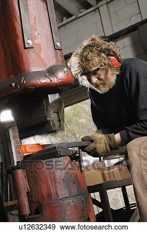 Caucasian man using power hammer. View Large Photo Image Stock Photo - Caucasian man using power hammer.. Fotosearch