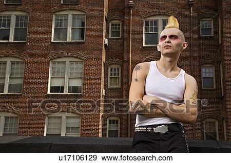Stock Photo - Male punk with building in background. Fotosearch