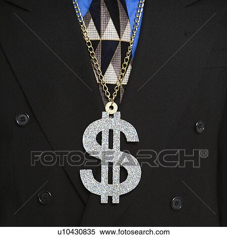 Stock Photography - Man in suit wearing necklace with money sign.. Fotosearch