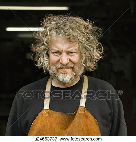 Portrait of Caucasian male metalsmith. View Large Photo Image Stock Photo - Portrait of Caucasian male metalsmith.. Fotosearch