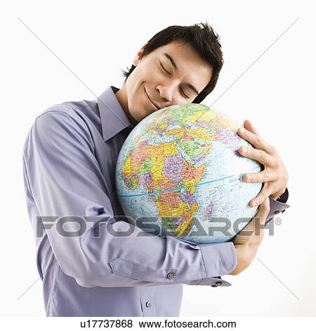 Young Asian man holding globe with happy expression on his face. View Large Photo Image Stock Photo - Young Asian man holding globe with happy expression on his face.. Fotosearch