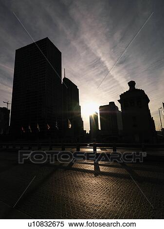 Buildings silhouetted by sun in Chicago, Illinois. View Large Photo Image Stock Photography - Buildings silhouetted by sun in Chicago, Illinois.. Fotosearch