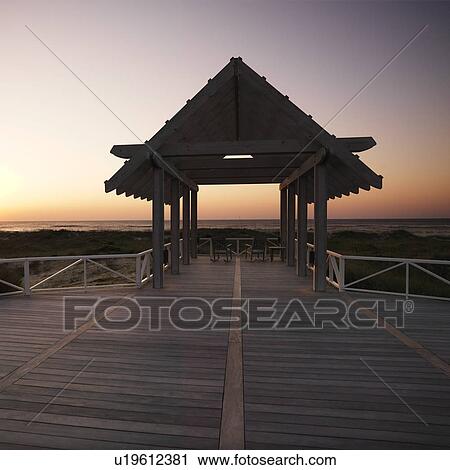 Gazebo at North Carolina coast with setting sun in background. View Large Photo Image Stock Image - Gazebo at North Carolina coast with setting sun in background.. Fotosearch