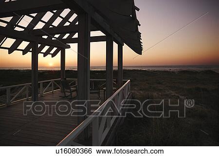 Gazebo at North Carolina coast with setting sun in background. View Large Photo Image Stock Photograph - Gazebo at North Carolina coast with setting sun in background.. Fotosearch