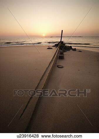 Stock Photo - Landscape shot of jetty with sunset . Fotosearch