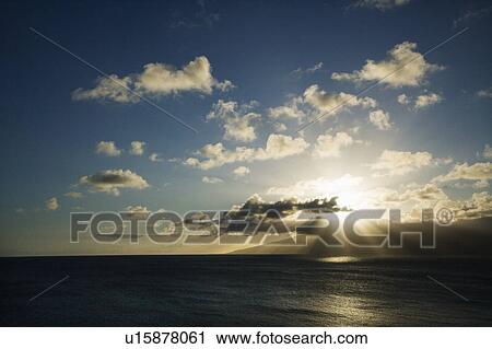 Pacific ocean and island with sun streaming through clouds. View Large Photo Image Stock Image - Pacific ocean and island with sun streaming through clouds.. Fotosearch