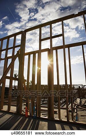 Wooden frame with sunburst in middle at construction site View Large Photo Image Stock Image - Wooden frame with sunburst in middle at construction site. Fotosearch