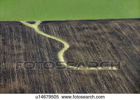 Aerial view of farmland with curvy path View Large Photo Image Stock Photography - Aerial view of farmland with curvy path . Fotosearch