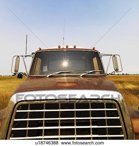 Stock Photo - Front view of farm truck in field.. Fotosearch