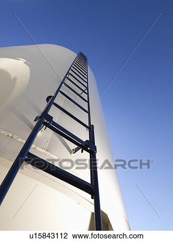 Low angle view of metal grain storage silo with ladder assending to top. View Large Photo Image Stock Image - Low angle view of metal grain storage silo with ladder assending to top.. Fotosearch