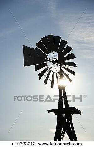 Silhouetted wind pump in South Dakota, USA View Large Photo Image Stock Image - Silhouetted wind pump in South Dakota, USA. Fotosearch