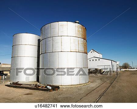 Two silos in rural setting View Large Photo Image Stock Image - Two silos in rural setting. Fotosearch
