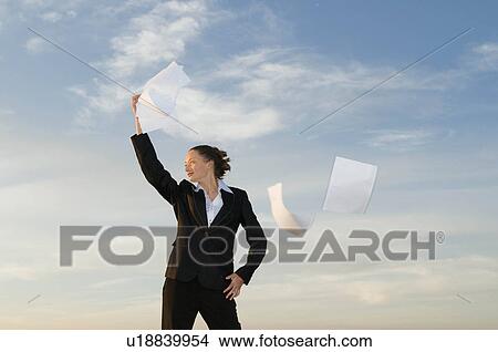 Picture - Businesswoman shot against the sky. Fotosearch