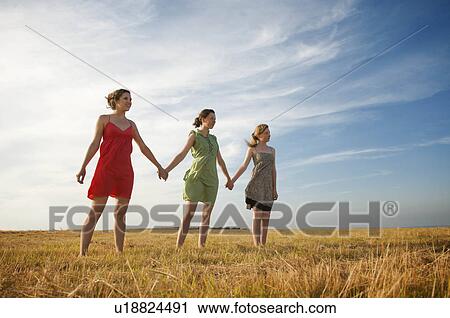 Three teenage girls hold hands View Large Photo Image Stock Image - Three teenage girls hold hands. Fotosearch