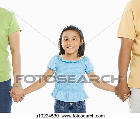 Asian girl holding hands with mother and father in front of white background. View Large Photo Image Stock Image - Asian girl holding hands with mother and father in front of white background.. Fotosearch