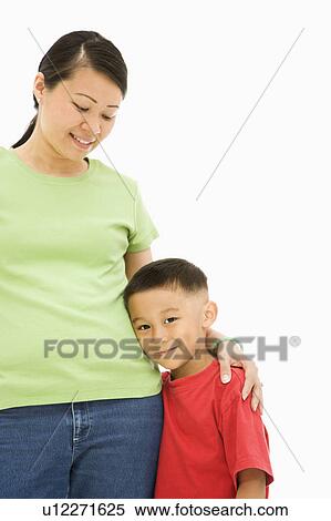 Asian mother standing with arm around son. View Large Photo Image Stock Photography - Asian mother standing with arm around son.. Fotosearch