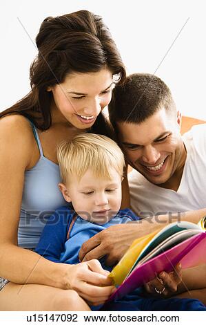 Caucasian parents and toddler son reading book. View Large Photo Image Stock Image - Caucasian parents and toddler son reading book.. Fotosearch
