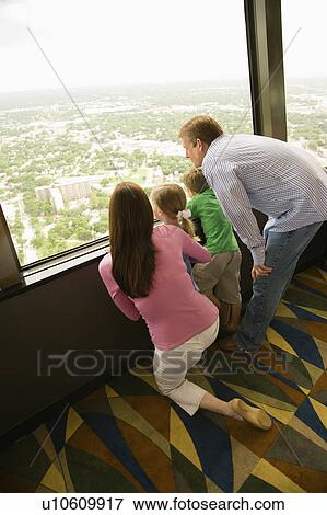 Family looking out observation deck at Tower of the Americas in San Antonio, Texas View Large Photo Image Stock Photo - Family looking out observation deck at Tower of the Americas in San Antonio, Texas. Fotosearch