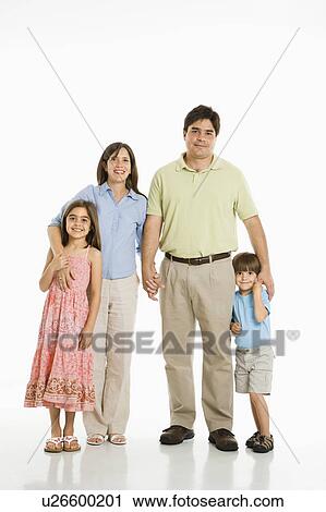Stock Image - Hispanic family of four standing against white background.. Fotosearch