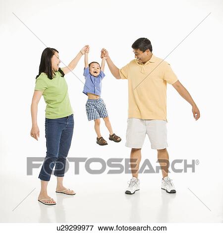Mother and father holding hands with son View Large Photo Image Stock Photo - Mother and father holding hands with son. Fotosearch