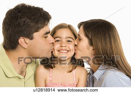 Mother and father kissing smiling daughter on cheek. View Large Photo Image Picture - Mother and father kissing smiling daughter on cheek.. Fotosearch